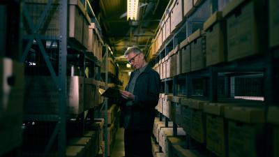 Dr Innes McCartney standing in the Lloyd's Register Foundation's archive.